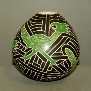 Sgraffito cactus, bird and geometric design on a polychrome jar