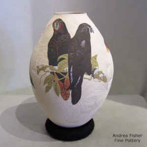 Sgraffito and painted parrot, branch and geometric design on a polychrome jar