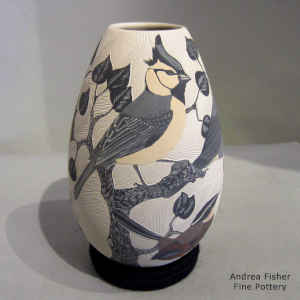 Sgraffito and painted bird, branch and geometric design on a polychrome jar