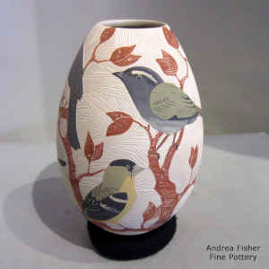 Sgraffito and painted bird, branch and geometric design on a polychrome jar