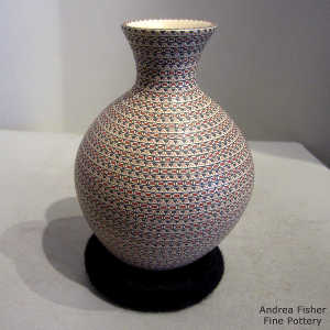 Bands of geometric design on a polychrome thin-neck jar