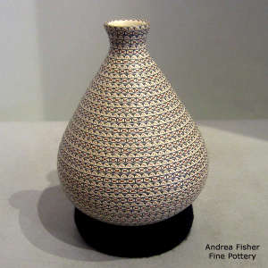 Bands of geometric design on a polychrome thin neck jar