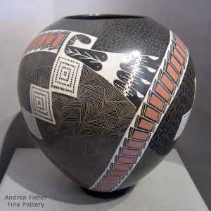 A sgraffito and painted geometric design on a polychrome jar