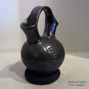 Geometric design on a black on black wedding vase