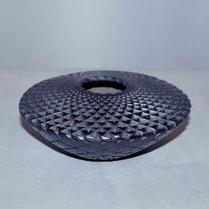Corrugated surface on a black flying saucer jar