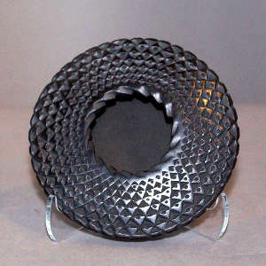 Corrugated surface on a black flying saucer jar