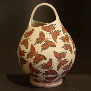 Butterfly design on a polychrome jar