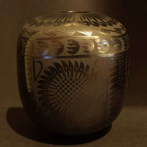Geometric design on a black on graphite black jar