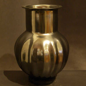 Ribbed black melon jar with a tall neck