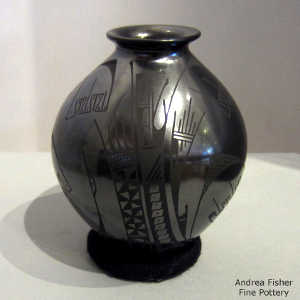 Bird element and geometric design on a black on black jar