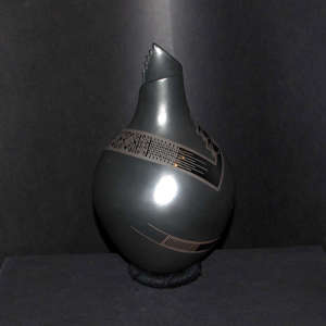 Geometric design on a black on black on black vase