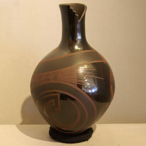 Geometric design on a black on black on black vase