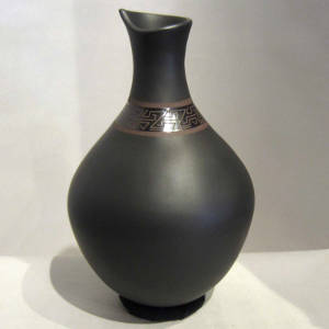 Organic opening on a black on black on black jar