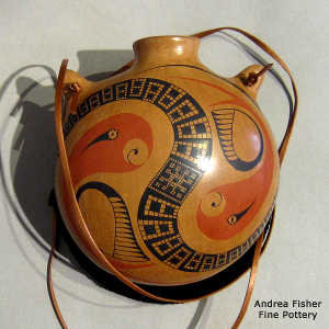 Stylized parrot and geometric design on a polychrome canteen