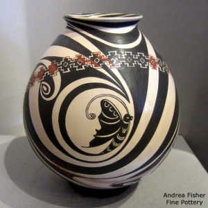 Butterfly and geometric design on a polychrome jar