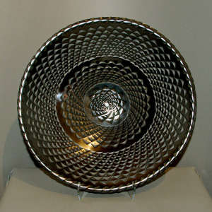 Geometric design carved into a large black bowl