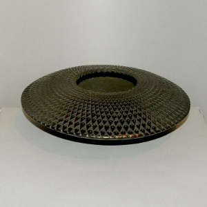 Corrugated surface on a black flying saucer jar