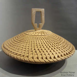 Corrugated surface on a lidded marbleized clay jar