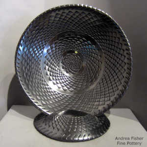 Textured design inside and out on a graphite black bowl