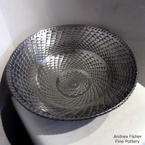 Textured surface inside and out on a black graphite bowl