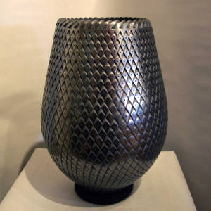 Corrugated surface on a highly polished black jar