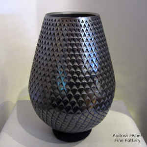 Corrugated surface on a tall black jar