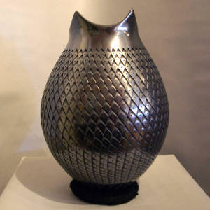 Corrugated surface on a black jar with a shaped neck