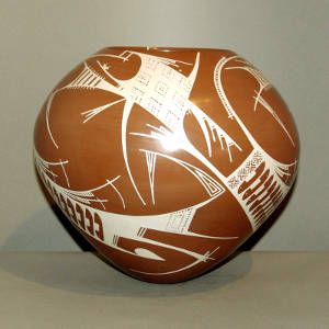 White geometric designs on a brown jar