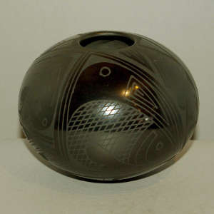 Fish and geometric design on a black on black jar