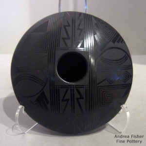 Geometric design on a black on black jar