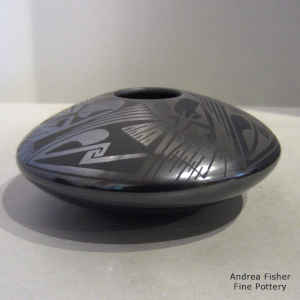 Geometric design on a black on black jar