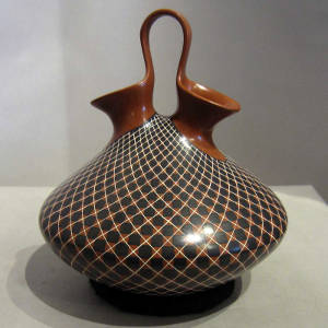 Multi-color painted geometric design on a wedding vase