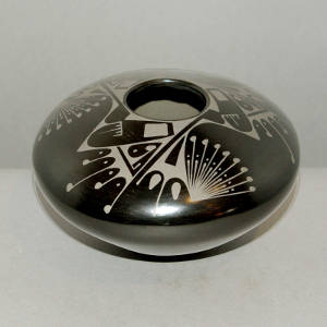 Geometric design on a black on black jar