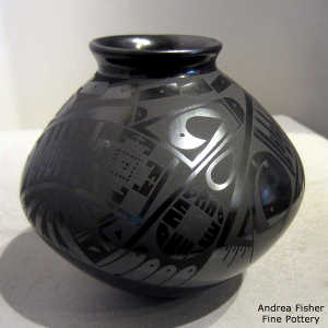 Bird element and geometric design on a black on black jar