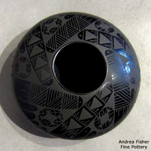 Geometric design on a black on black jar