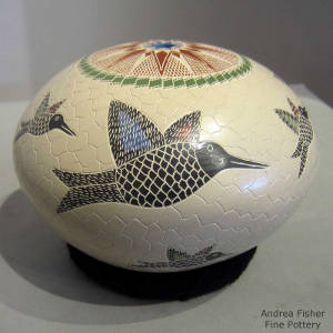 Sgraffito and painted hummingbird and geometric designs on a polychrome seedpot