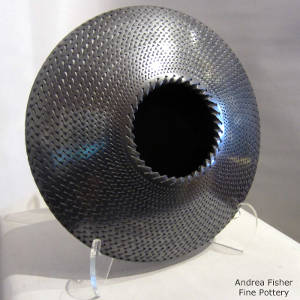 Corrugated surface on a black flying saucer jar