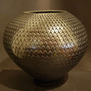 Black graphite jar with a textured surface