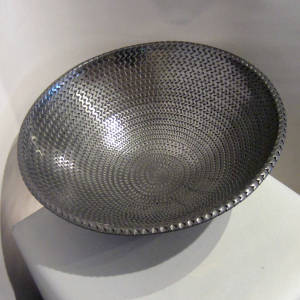 Corrugated surface inside and out on a large black bowl