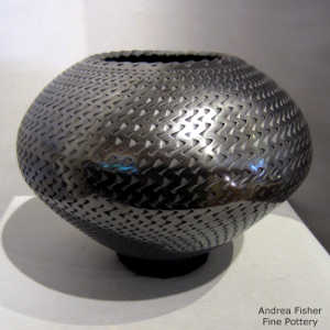 Corrugated surface on a polished black jar