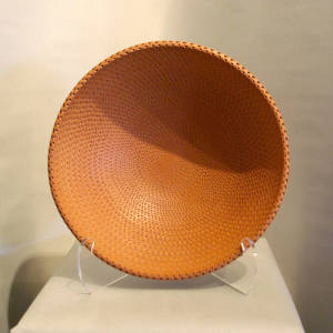 Corrugated surface on a large red bowl