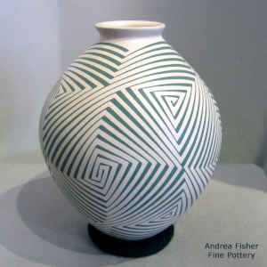 Green geometric design on a tan jar