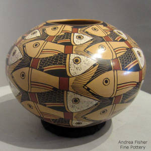 Fish and geometric design on a polychrome jar