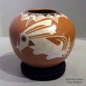 Polychrome jar with a rabbit and geometric design