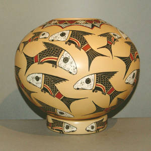 Fish and geometric design on a polychrome jar with a matching stand