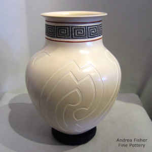 Sgraffito and painted geometric design on a polychrome jar