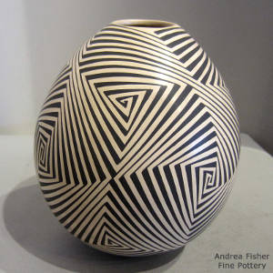 Geometric design decorating a black and tan jar