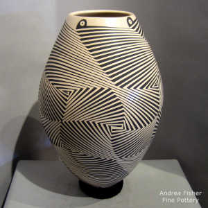 Black geometric design on a tan jar