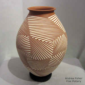 White on terra cotta jar with geometric design
