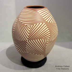 White on terra cotta jar with geometric design